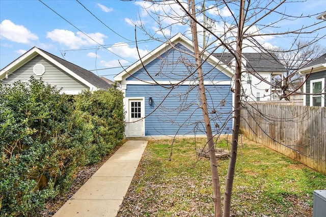 rear view of house with fence