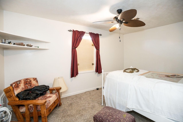 carpeted bedroom featuring ceiling fan and baseboards