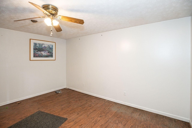 spare room featuring a ceiling fan, a textured ceiling, baseboards, and wood finished floors