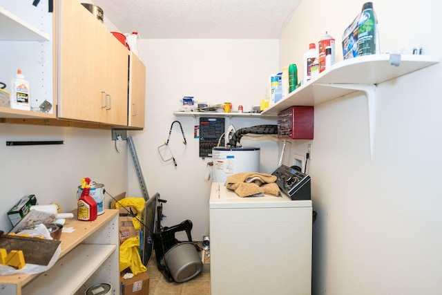 laundry room with a textured ceiling, washer hookup, gas water heater, and cabinet space