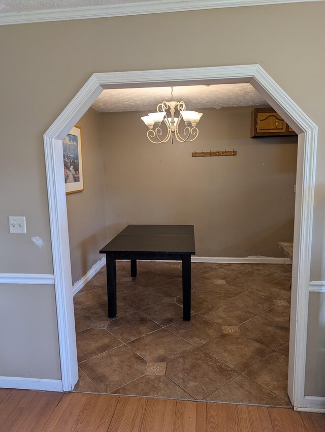 4460 Bold Springs Rd, Mc Ewen, TN 37101 - unfurnished dining area with a chandelier and baseboards
