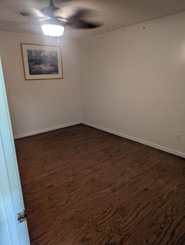 4460 Bold Springs Rd, Mc Ewen, TN 37101 - empty room with dark wood finished floors, baseboards, and ceiling fan