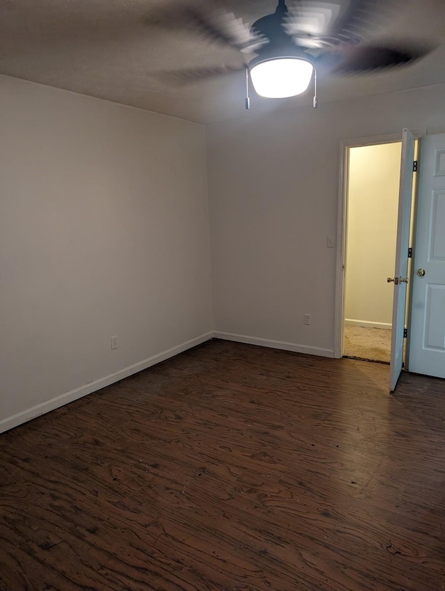 4460 Bold Springs Rd, Mc Ewen, TN 37101 - spare room with dark wood-type flooring, baseboards, and a ceiling fan