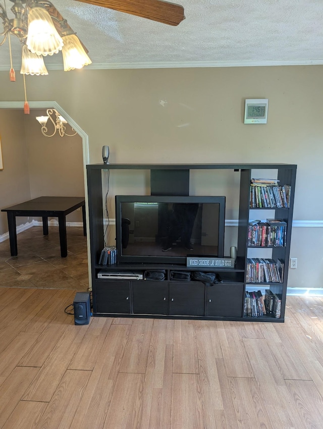 4460 Bold Springs Rd, Mc Ewen, TN 37101 - detailed view of wood finished floors, a textured ceiling, crown molding, a chandelier, and baseboards