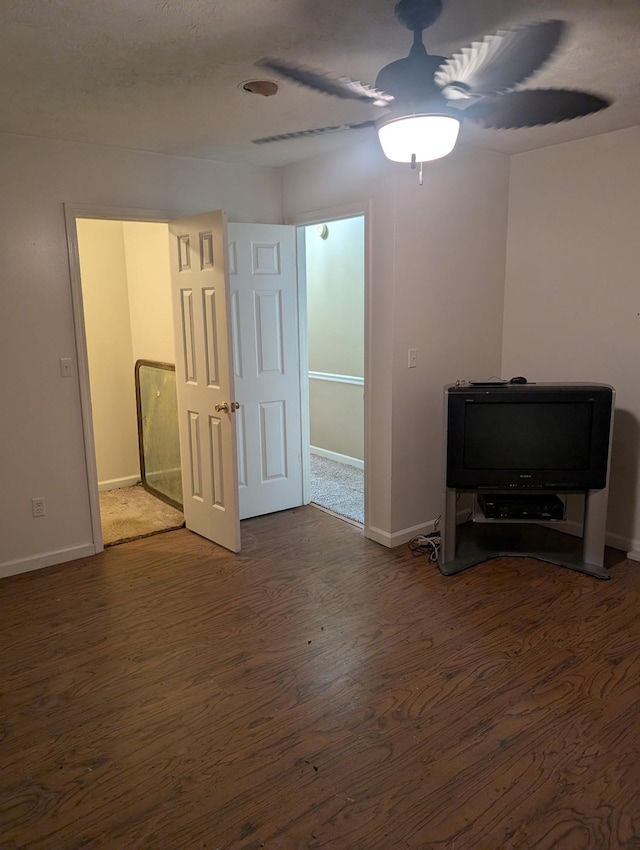 4460 Bold Springs Rd, Mc Ewen, TN 37101 - unfurnished living room featuring wood finished floors, a ceiling fan, and baseboards
