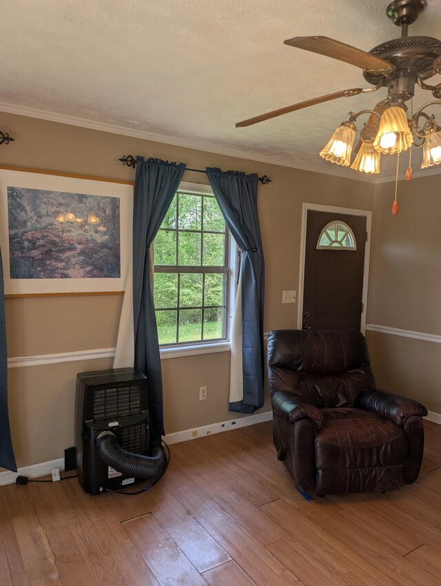 4460 Bold Springs Rd, Mc Ewen, TN 37101 - living area featuring ceiling fan, wood finished floors, baseboards, and crown molding