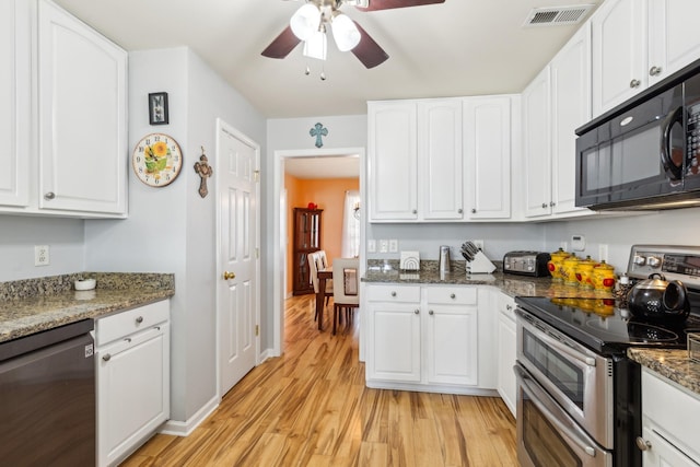 kitchen featuring visible vents, white cabinets, light wood-style flooring, appliances with stainless steel finishes, and stone counters