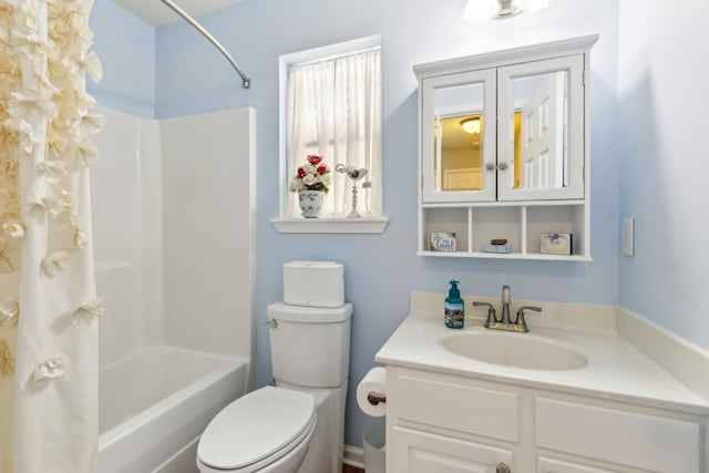 bathroom featuring shower / tub combo, vanity, and toilet