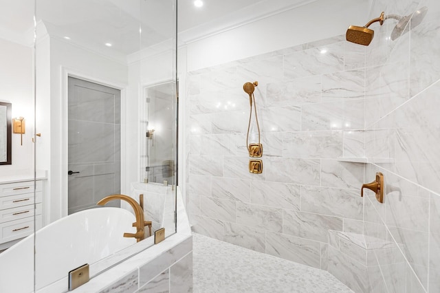 full bathroom with ornamental molding, a freestanding tub, and a tile shower