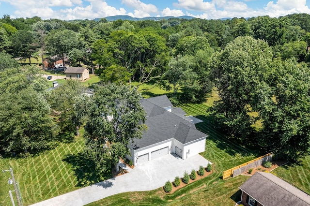 drone / aerial view featuring a view of trees