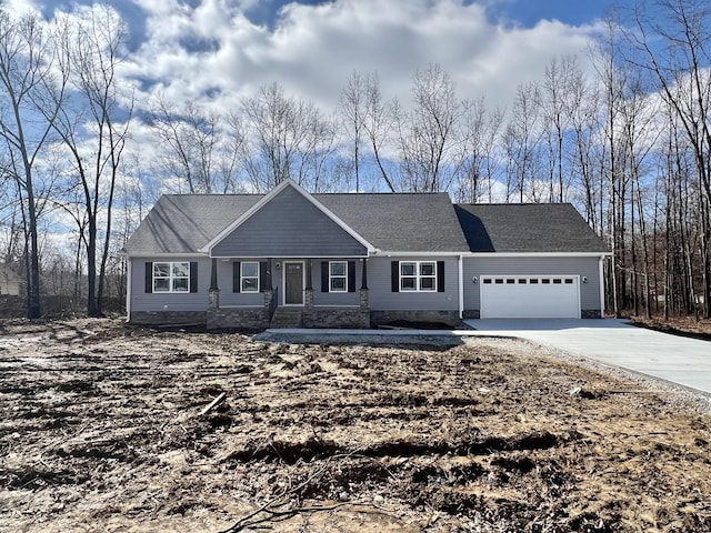 single story home featuring driveway and a garage