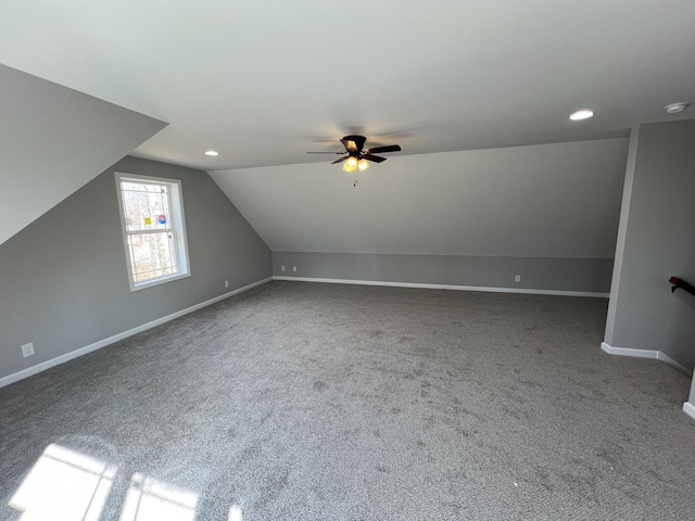 additional living space featuring baseboards, ceiling fan, vaulted ceiling, carpet floors, and recessed lighting