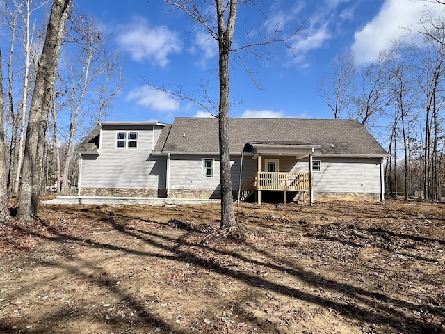 rear view of property with covered porch