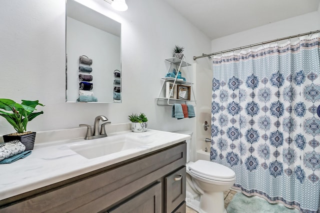 full bathroom featuring toilet, shower / bath combo, and vanity