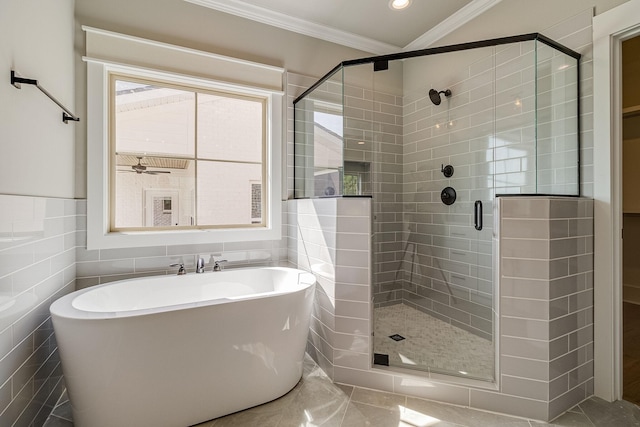 full bathroom with a healthy amount of sunlight, a stall shower, a soaking tub, and crown molding