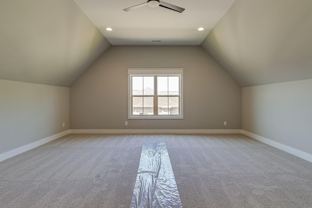 bonus room with recessed lighting, a ceiling fan, light carpet, vaulted ceiling, and baseboards