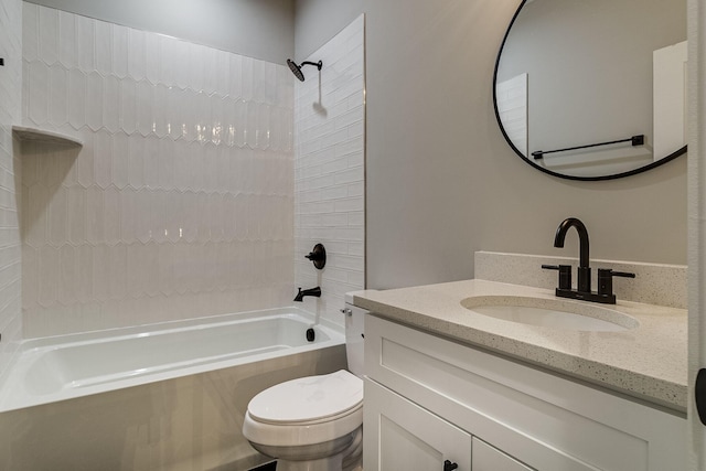 bathroom featuring toilet, bathtub / shower combination, and vanity