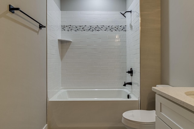 bathroom with washtub / shower combination, vanity, and toilet