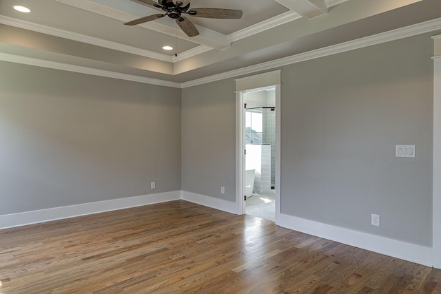 spare room featuring crown molding, recessed lighting, a ceiling fan, wood finished floors, and baseboards