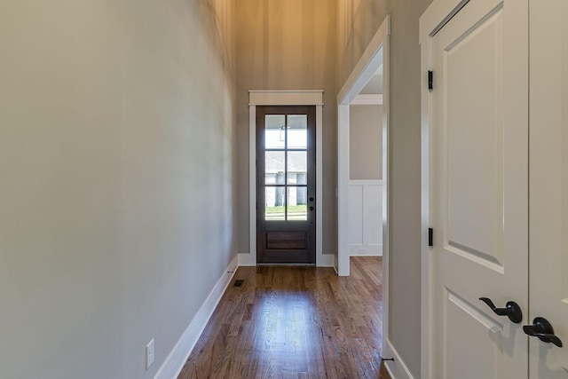 entryway featuring dark wood-style floors and baseboards