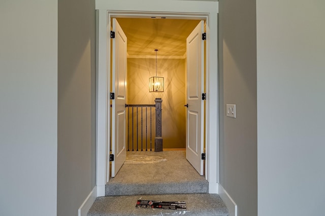 corridor featuring carpet and baseboards