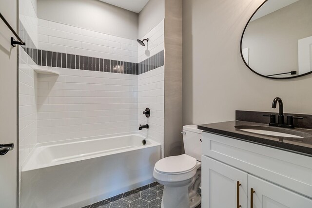 bathroom with toilet, shower / tub combination, and vanity