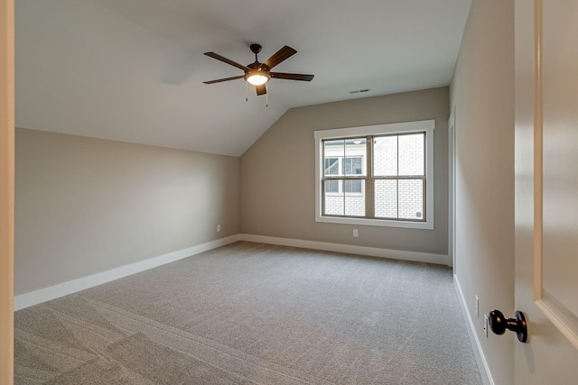 bonus room with carpet floors, visible vents, vaulted ceiling, ceiling fan, and baseboards