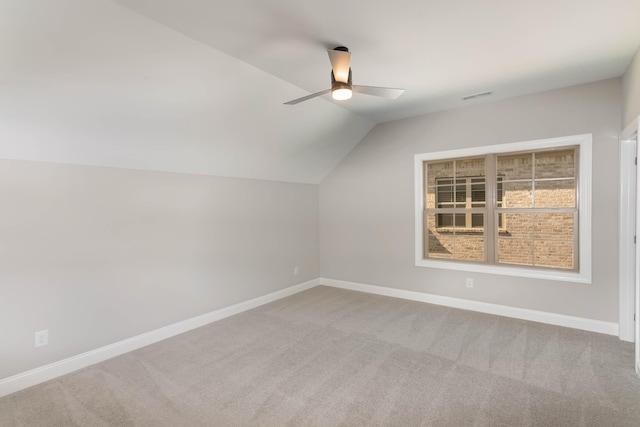 bonus room with lofted ceiling, carpet floors, visible vents, and baseboards