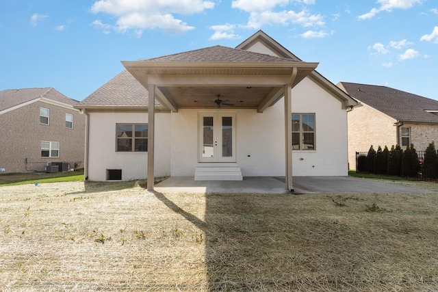 back of house with ceiling fan, cooling unit, brick siding, french doors, and a patio area