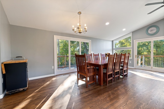 dining space featuring lofted ceiling, baseboards, and wood finished floors