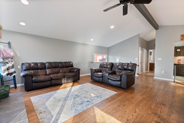 living area featuring lofted ceiling with beams, baseboards, wood finished floors, and recessed lighting