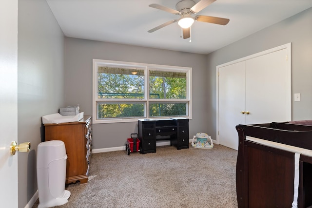 carpeted bedroom featuring a closet, a ceiling fan, and baseboards