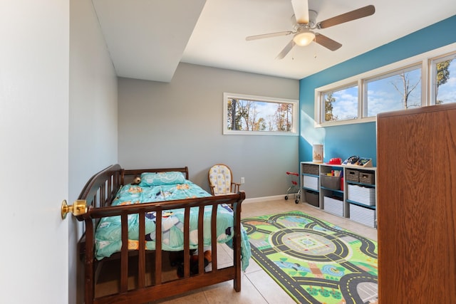 bedroom featuring ceiling fan and baseboards