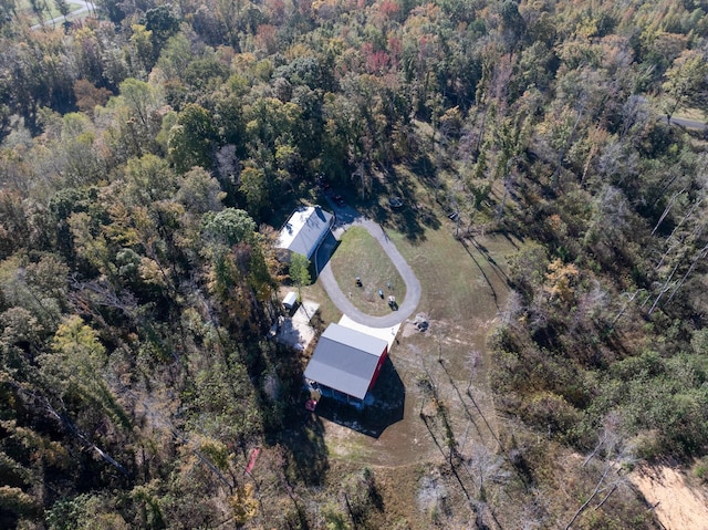 birds eye view of property with a forest view