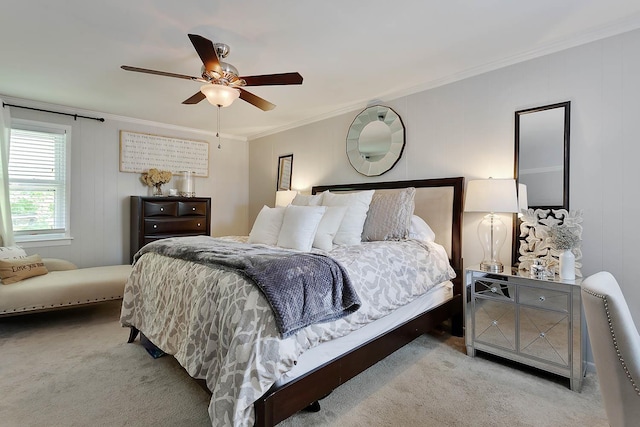 bedroom with carpet floors, a ceiling fan, and crown molding