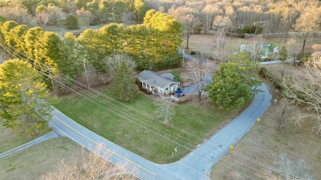 aerial view featuring a wooded view