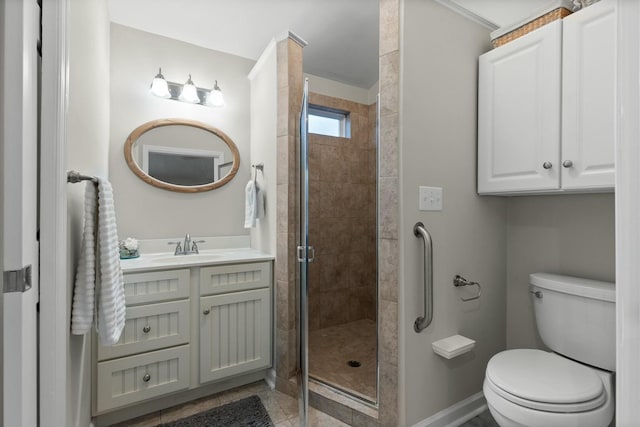 full bath with tile patterned flooring, toilet, vanity, baseboards, and a stall shower