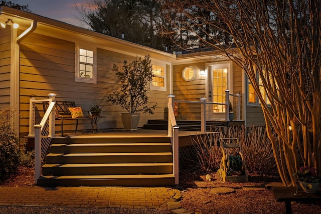 view of back of property at dusk