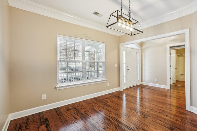 foyer entrance with ornamental molding, wood finished floors, visible vents, and baseboards