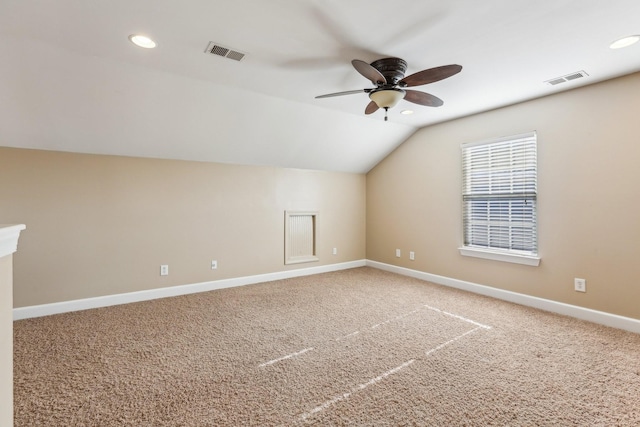 bonus room with lofted ceiling, carpet floors, baseboards, and visible vents