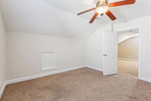 additional living space with lofted ceiling, ceiling fan, carpet flooring, visible vents, and baseboards