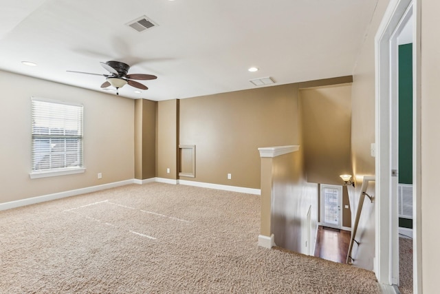 unfurnished room featuring baseboards, visible vents, carpet flooring, and recessed lighting