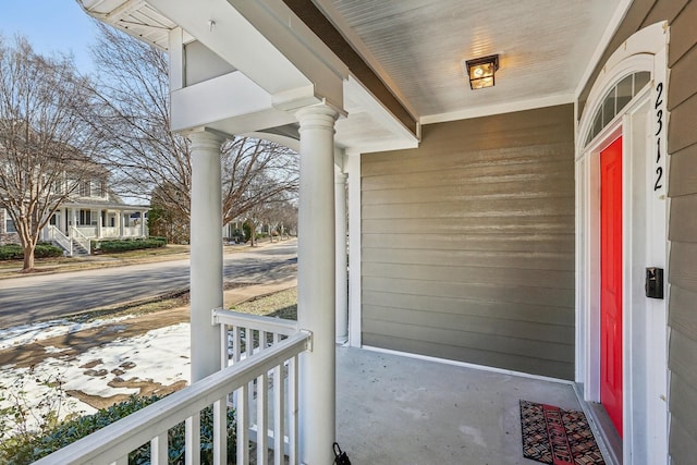 property entrance with covered porch