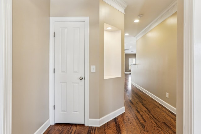 hall with ornamental molding, recessed lighting, dark wood-style flooring, and baseboards