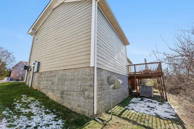 view of side of home with cooling unit and a wooden deck