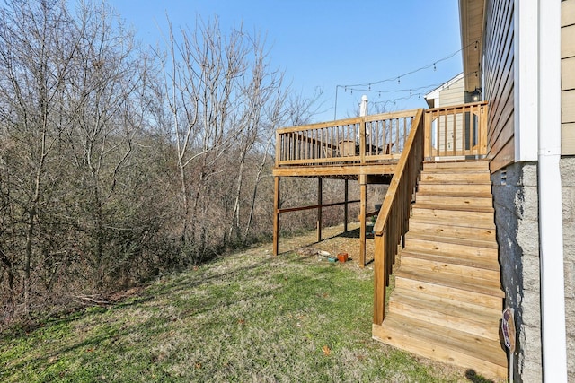 view of yard featuring a deck and stairs