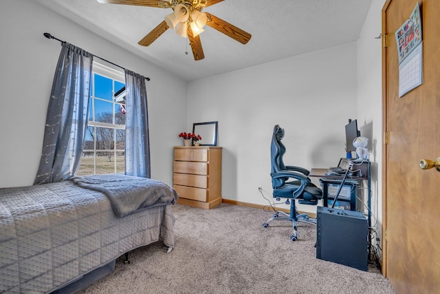 bedroom featuring carpet flooring, a ceiling fan, and baseboards