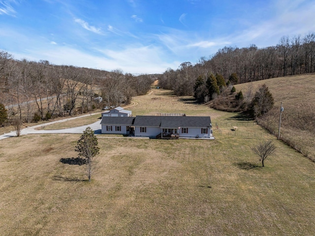 drone / aerial view with a forest view and a rural view