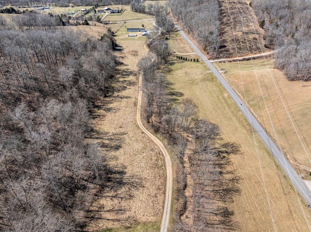 birds eye view of property with a rural view