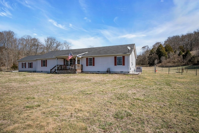 single story home with a front lawn, crawl space, a wooden deck, and fence